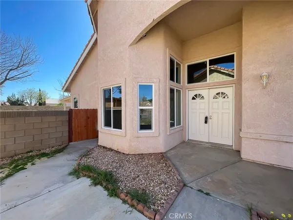 a front view of a house with a garage