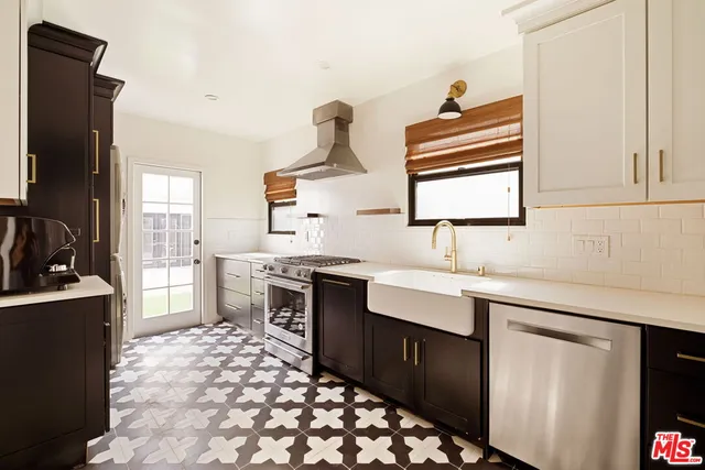 a kitchen with a sink stove and refrigerator