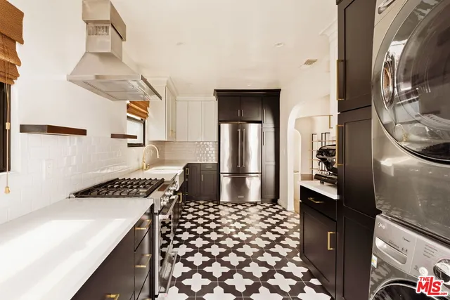 a kitchen with a refrigerator and a stove