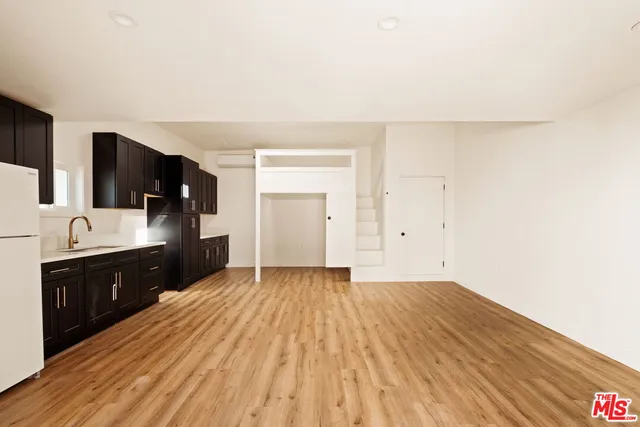 a spacious bathroom with a sink and a mirror