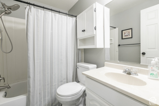 1764 West 1200th Street North Mapleton, UT 84664 - Photo 33 of 35 White vanity with integrated sink, chrome faucet, wall-mounted mirror, and overhead cabinetry
