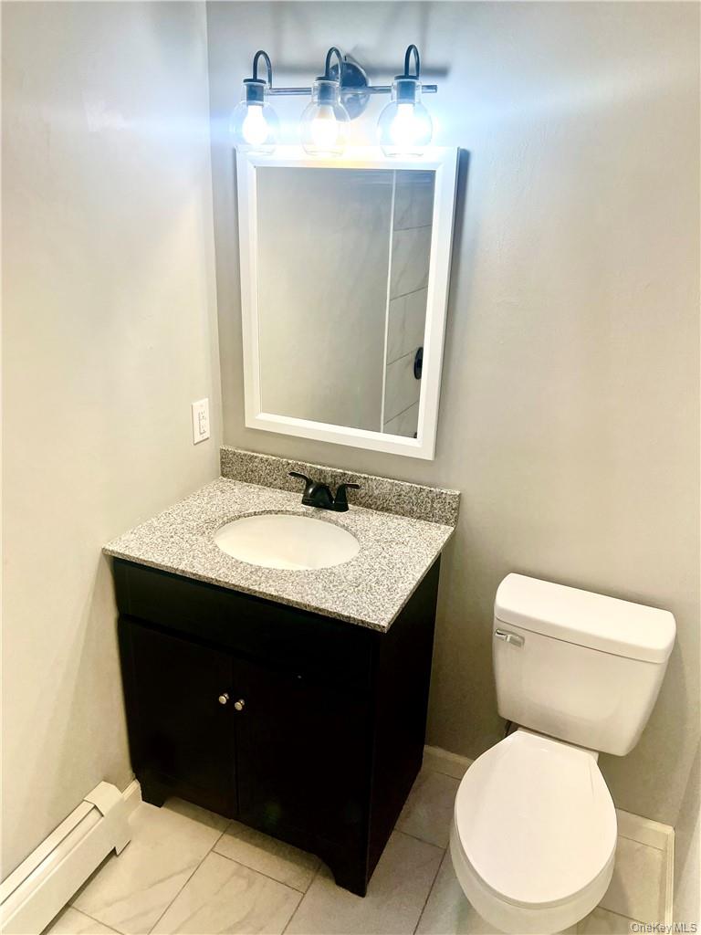 39 Church Street, Unit 53 Port Jervis, NY 12771 - Photo 24 of 32 a bathroom with a sink and a toilet