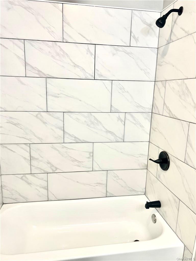 39 Church Street, Unit 53 Port Jervis, NY 12771 - Photo 26 of 32 a bathroom with a bathtub