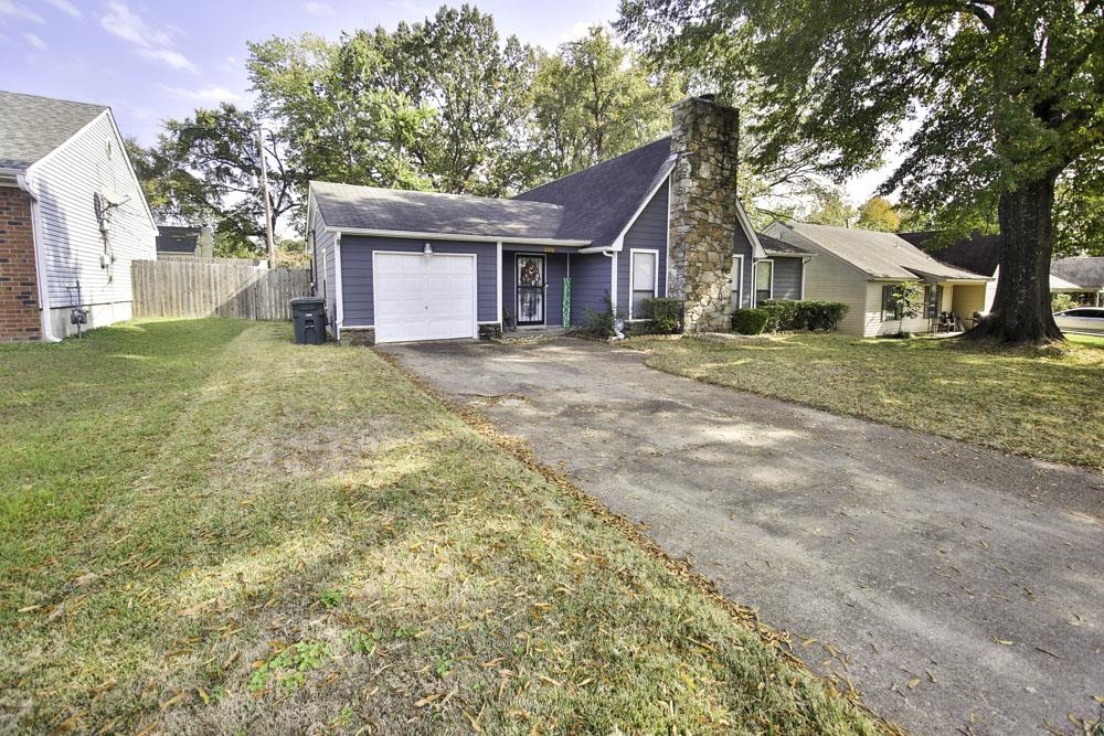 4352 Cloudburst Road Memphis, TN 38141 - Photo 19 of 21 Ranch-style home with a front lawn and a garage