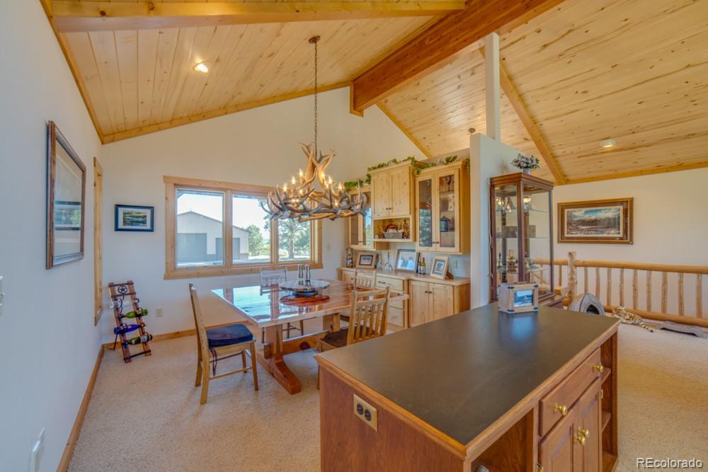 8615 Highway 165 Rye, CO 81069 - Photo 21 of 37 a view of a dining room with furniture and chandelier