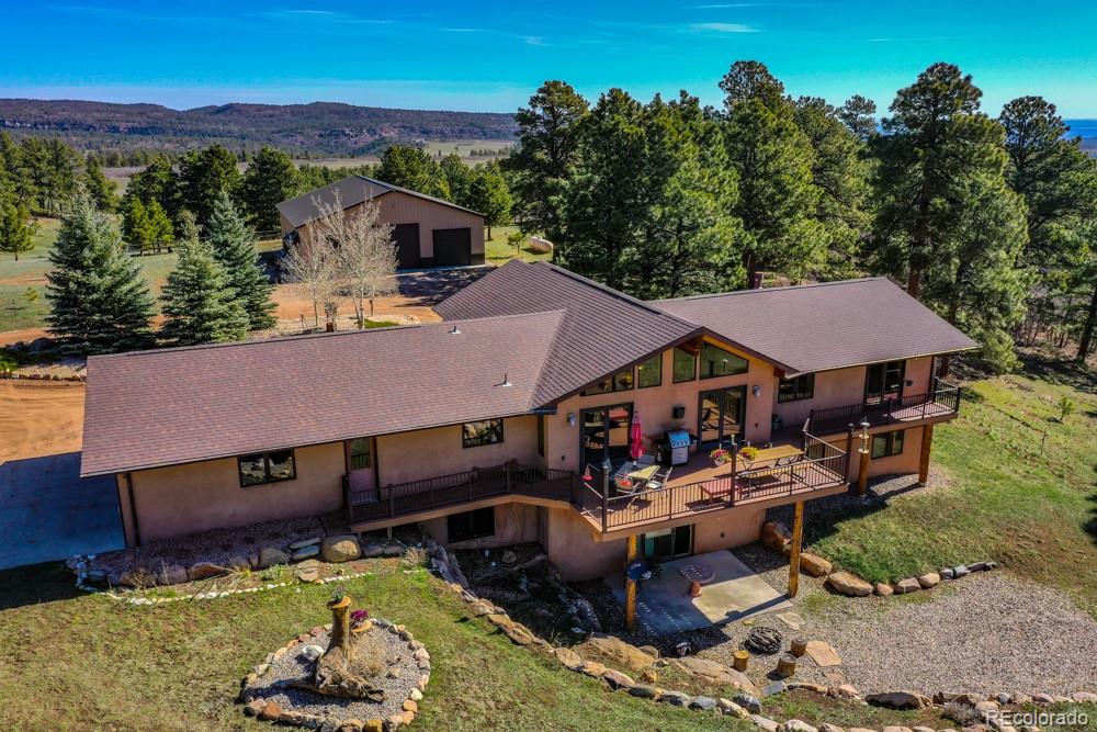 8615 Highway 165 Rye, CO 81069 - Photo 3 of 37 an aerial view of a house with swimming pool and a yard