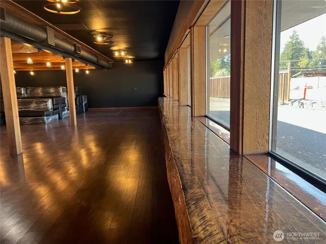 a view of a studio with wooden floor