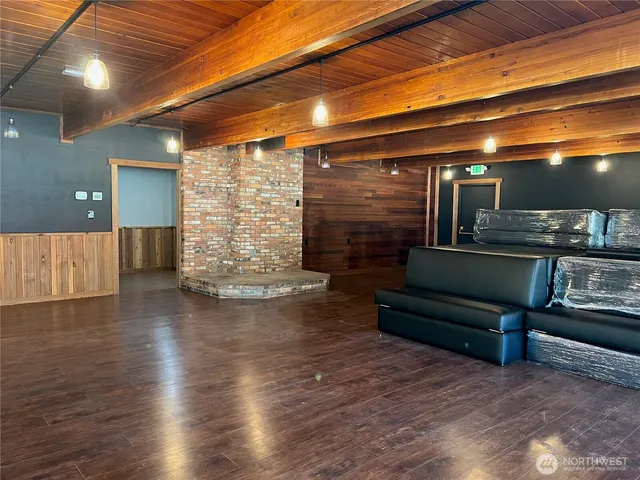 a living room with furniture gym and a large window