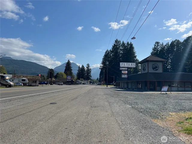 a view of a hall with wooden floor