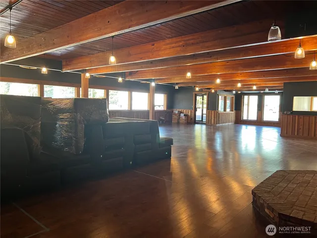 a view of a house with a patio and a yard