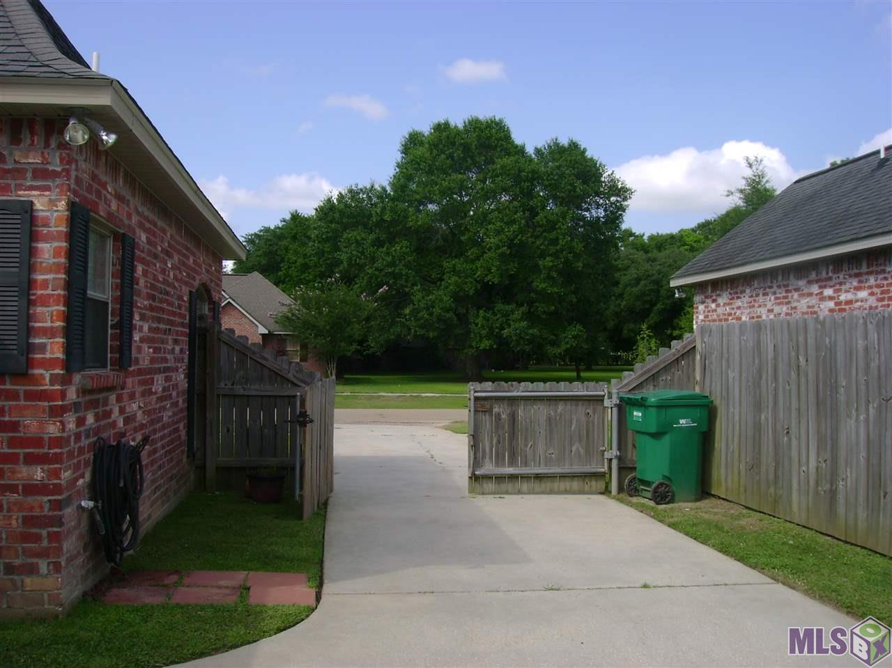 9348 Rue De Benoit Denham Springs, LA 70706 - Photo 6 of 36 Beautiful green spaces and blue skies