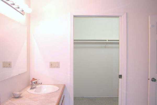 19-4128 Wright Road, Unit 1 Volcano, HI 96785 - Photo 14 of 36 a bathroom with a sink a mirror and a toilet