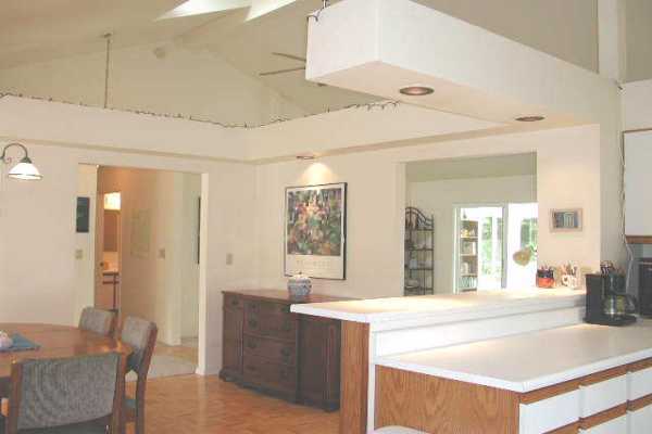 19-4128 Wright Road, Unit 1 Volcano, HI 96785 - Photo 3 of 36 a living room with stainless steel appliances kitchen island granite countertop furniture and a kitchen view