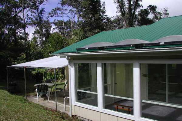 19-4128 Wright Road, Unit 1 Volcano, HI 96785 - Photo 32 of 36 a view of house with outdoor space and porch