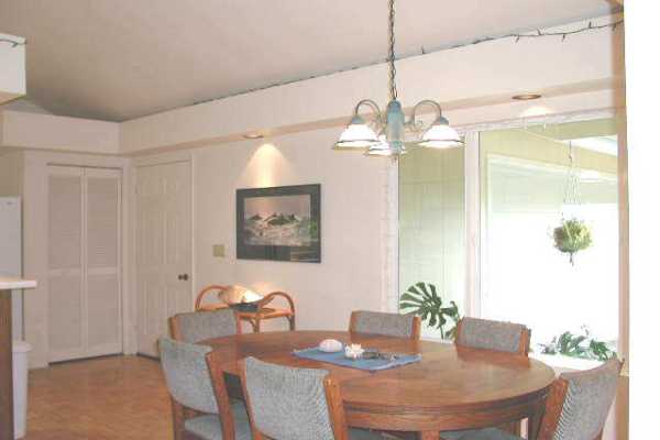 19-4128 Wright Road, Unit 1 Volcano, HI 96785 - Photo 5 of 36 a dining room with furniture and wooden floor