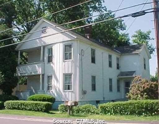 327 Brick Top Road Windham, CT 06280 - Photo 1 of 1 a view of a white house with large windows and a small yard
