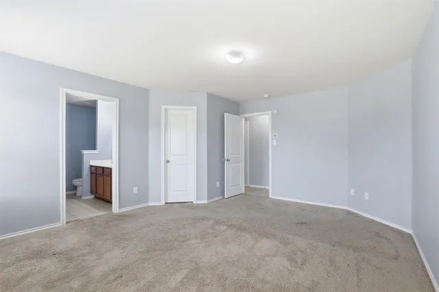 a view of an empty room with a fireplace