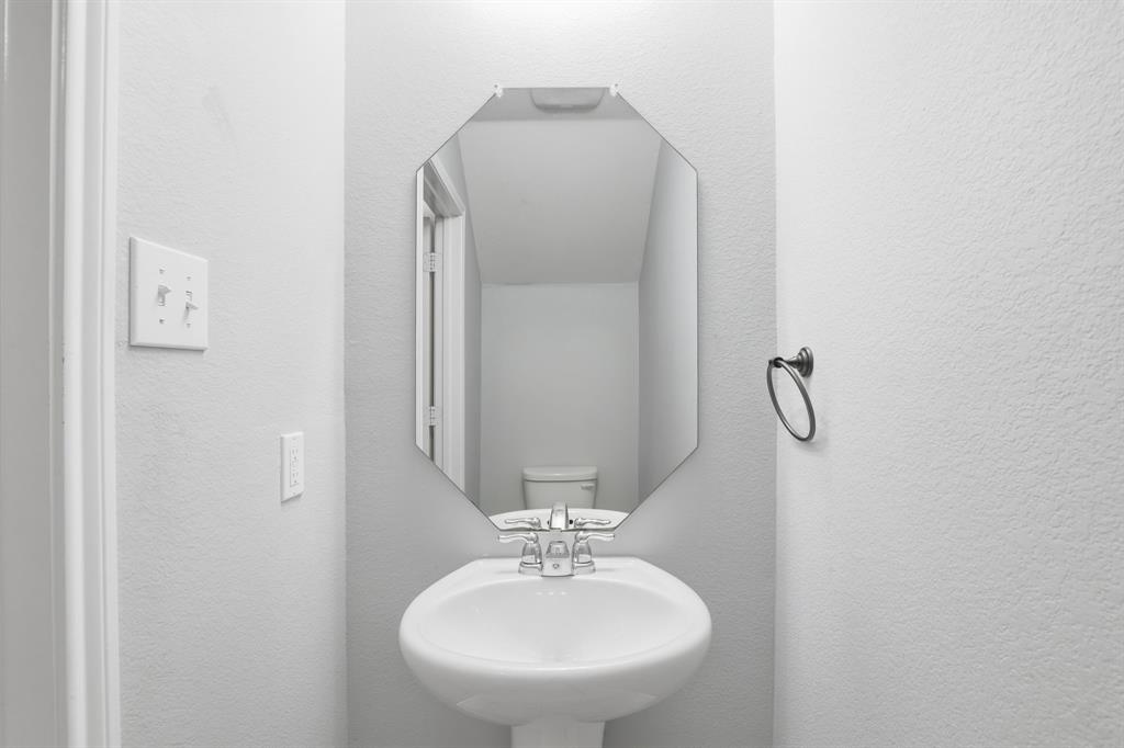 3035 Seth Lane Forney, TX 75126 - Photo 19 of 31 a bathroom with a sink and a mirror