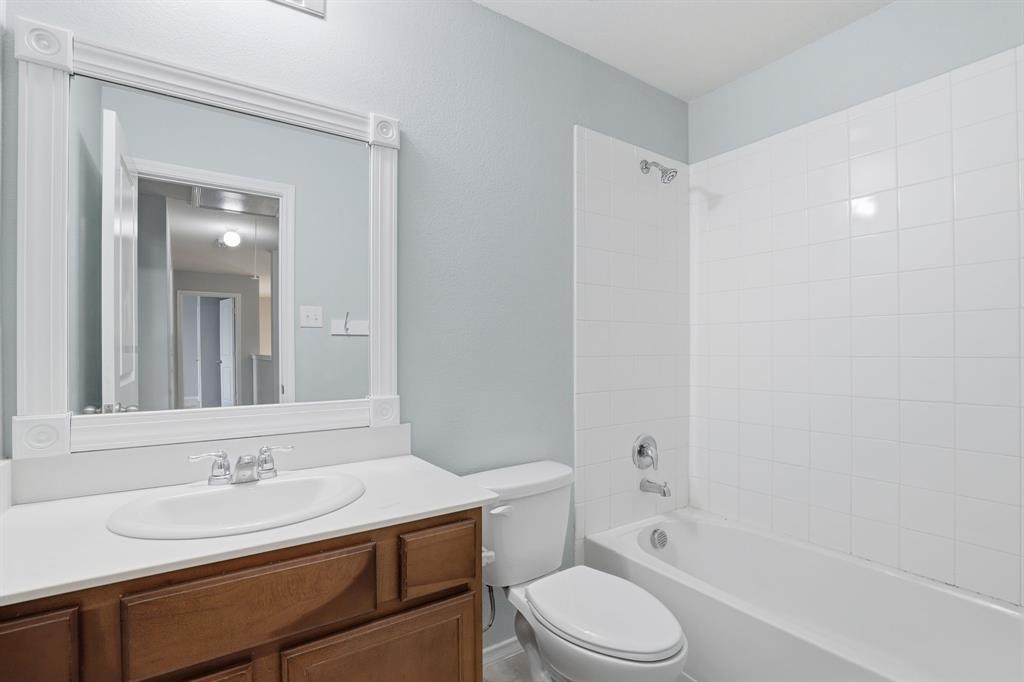 3035 Seth Lane Forney, TX 75126 - Photo 23 of 31 a bathroom with a sink a toilet and shower