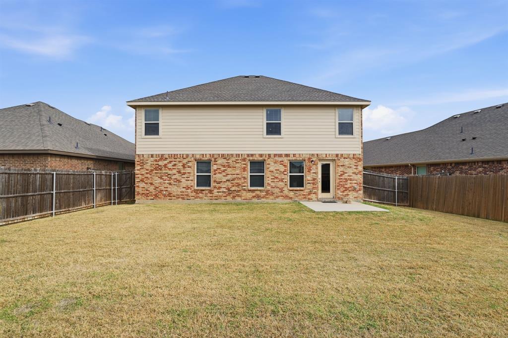 3035 Seth Lane Forney, TX 75126 - Photo 26 of 31 a view of a house with a yard