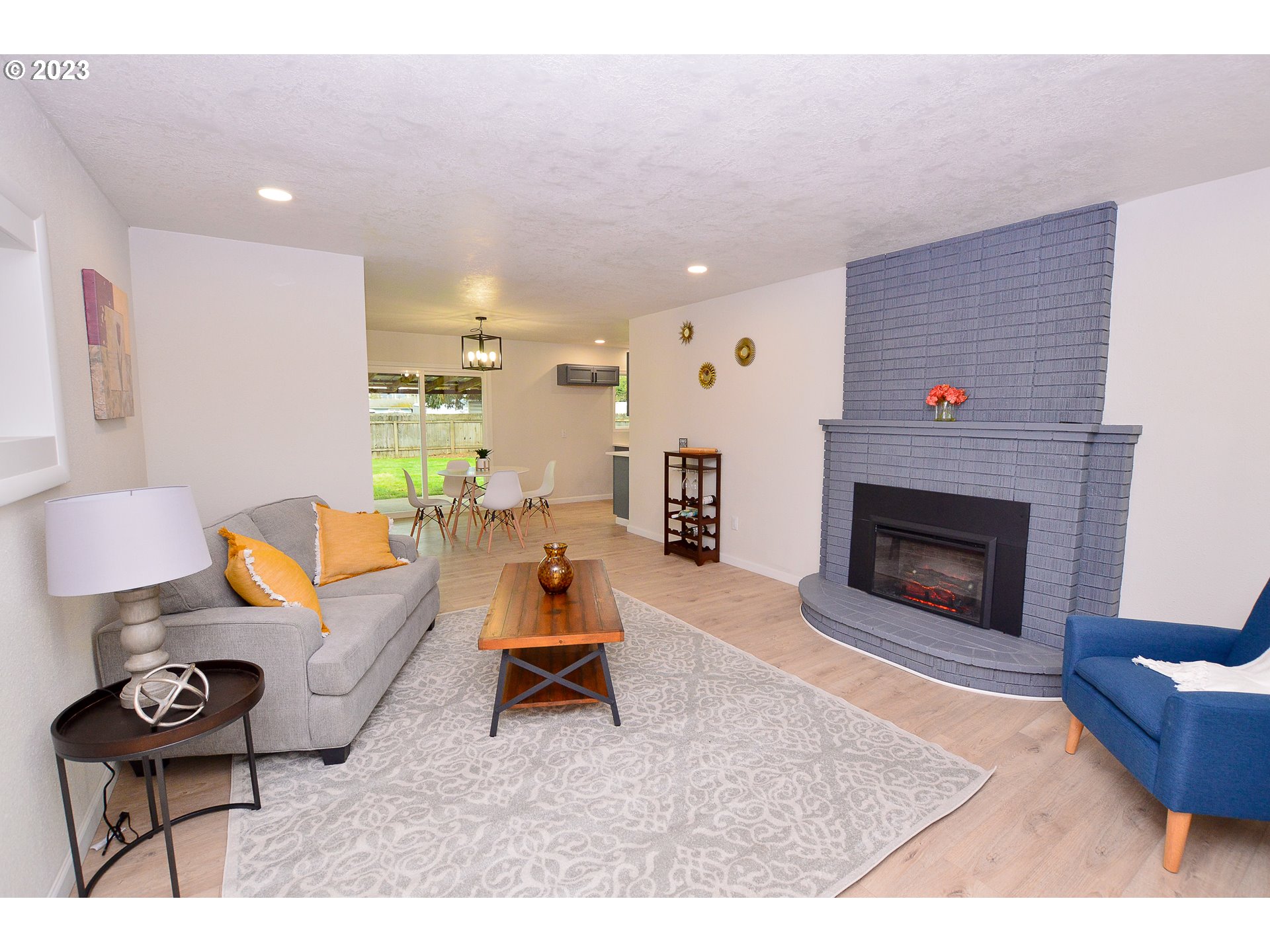 419 25th Street Springfield, OR 97477 - Photo 3 of 17 a living room with furniture and a fireplace