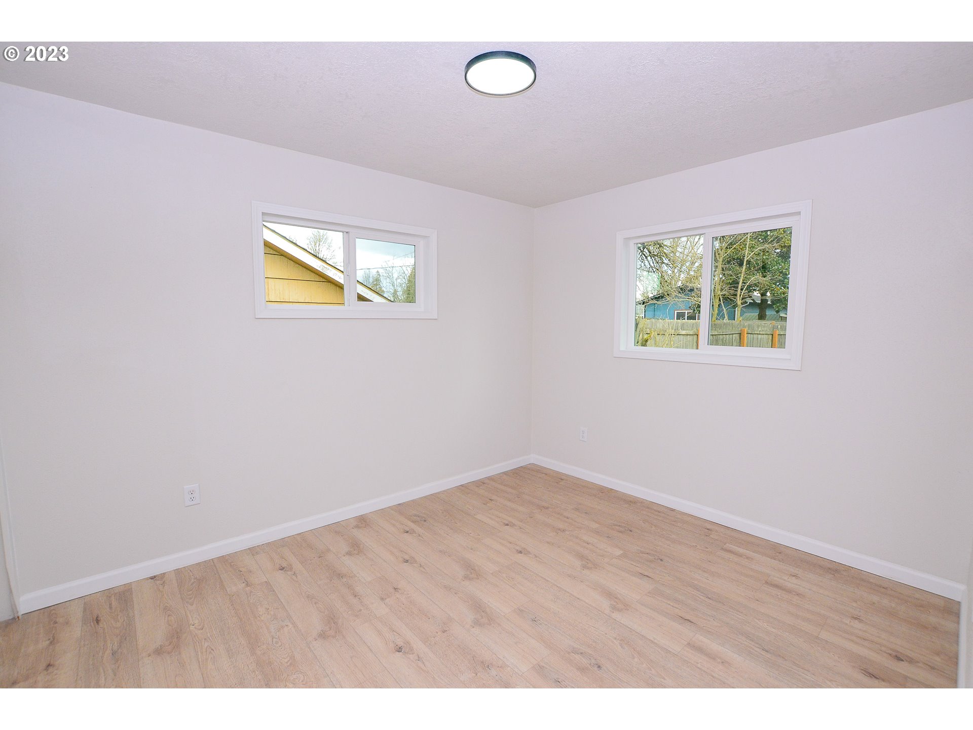 419 25th Street Springfield, OR 97477 - Photo 8 of 17 a view of an empty room with a window