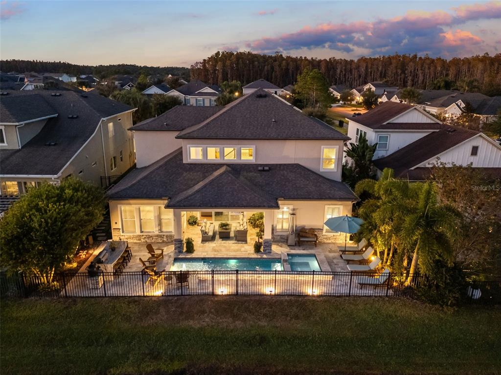 14822 Trails Edge Boulevard Odessa, FL 33556 - Photo 2 of 73 an aerial view of a house with a garden and lake view