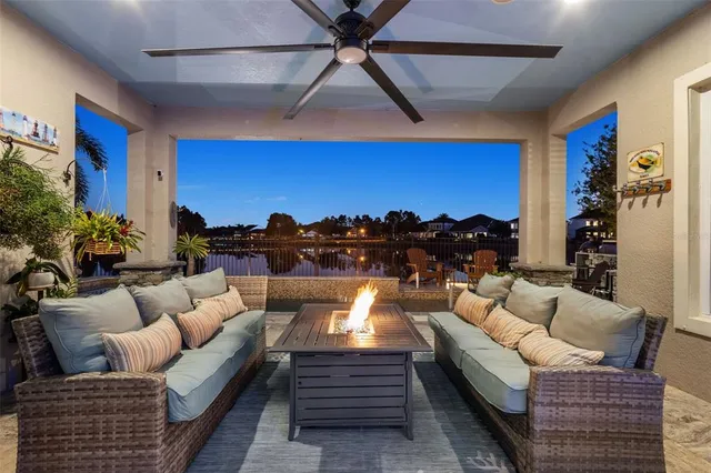 a living room with furniture a lamp and a fireplace