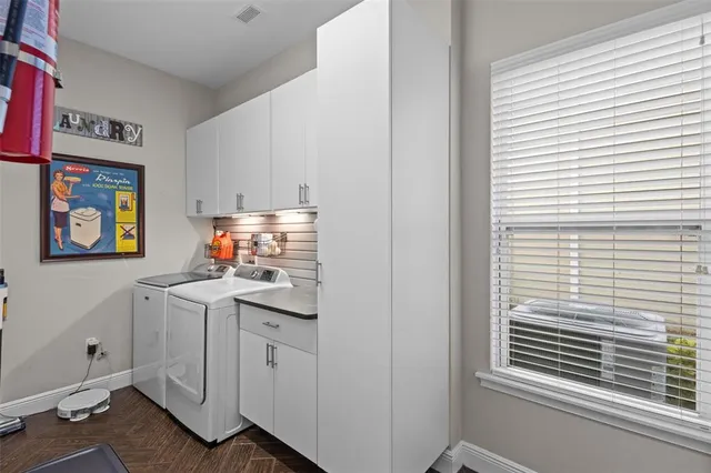 a front view of a house with a yard table and chairs