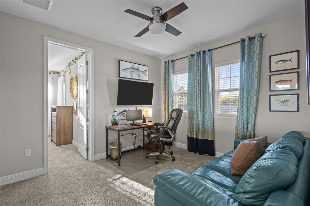 14822 Trails Edge Boulevard Odessa, FL 33556 - Photo 35 of 73 a view of a livingroom with workspace and a window