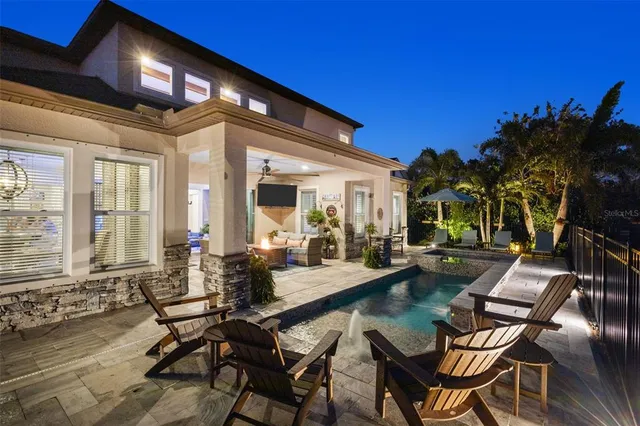 an aerial view of a house with a lake view