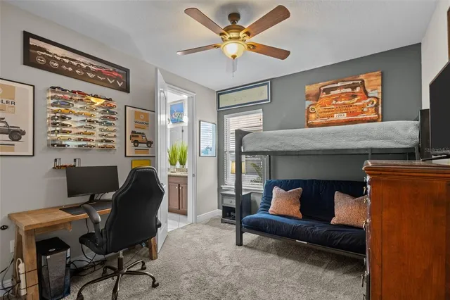 an aerial view of a house with a garden and lake view