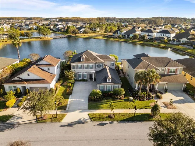 a living room with fireplace furniture and a chandelier
