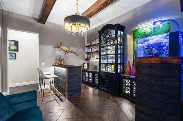 a living room with furniture a large window and a clock