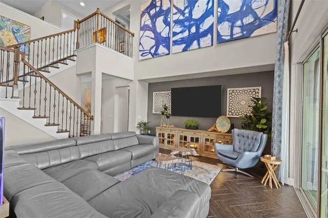 a kitchen with large counter space and chandelier