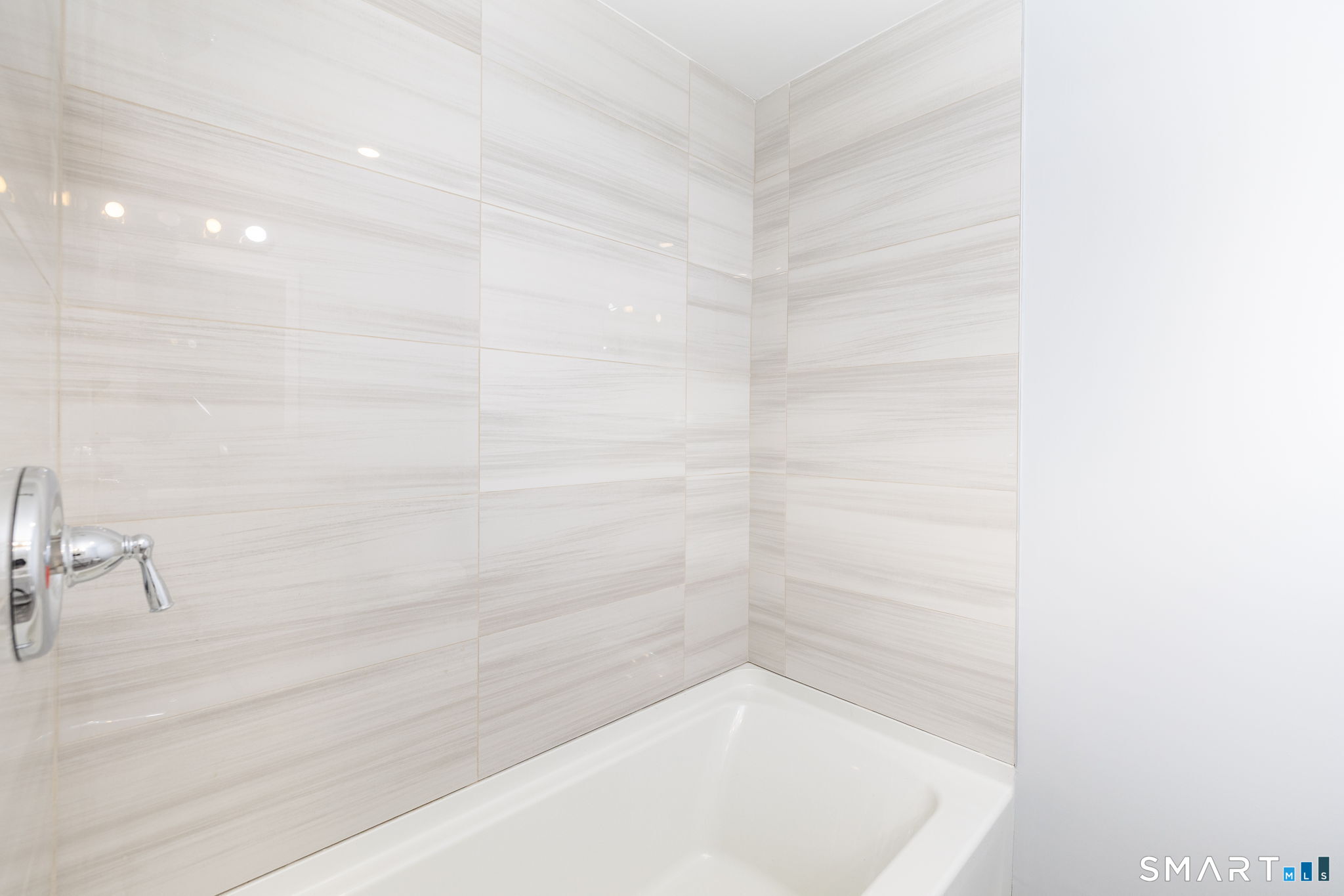 153 Gridley Street Bristol, CT 06010 - Photo 7 of 14 a bathroom with a bathtub