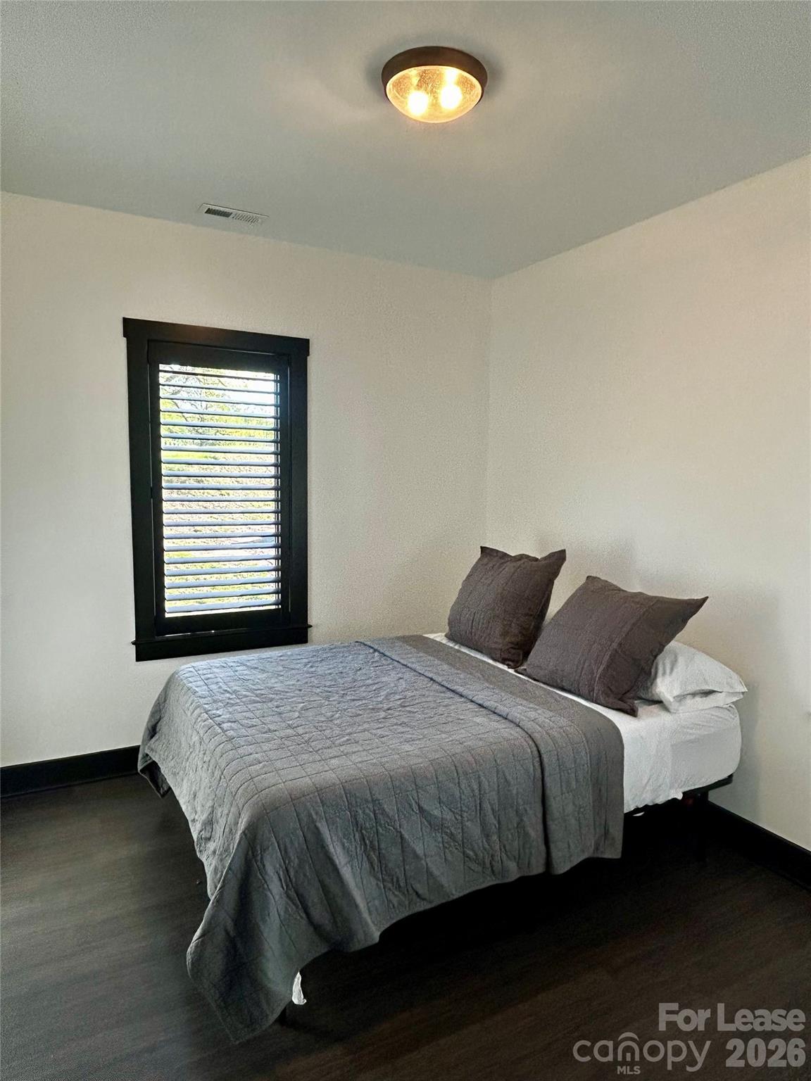 23 Shoals Falls Road Hendersonville, NC 28739 - Photo 11 of 13 a bedroom with a bed and a window