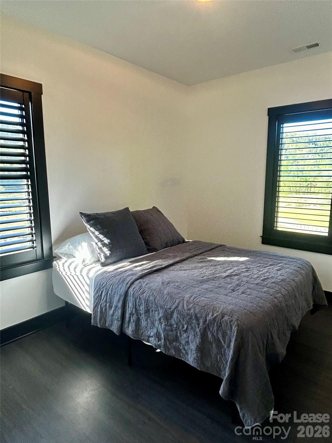 23 Shoals Falls Road Hendersonville, NC 28739 - Photo 6 of 13 a bedroom with a bed and window