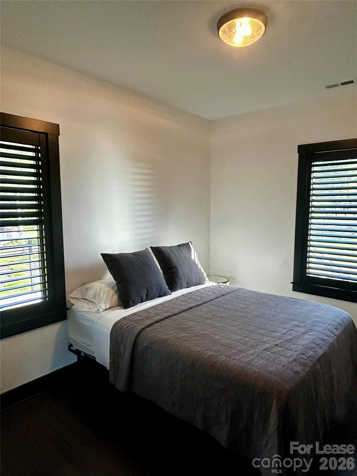 23 Shoals Falls Road Hendersonville, NC 28739 - Photo 10 of 13 a bedroom with a bed and a table