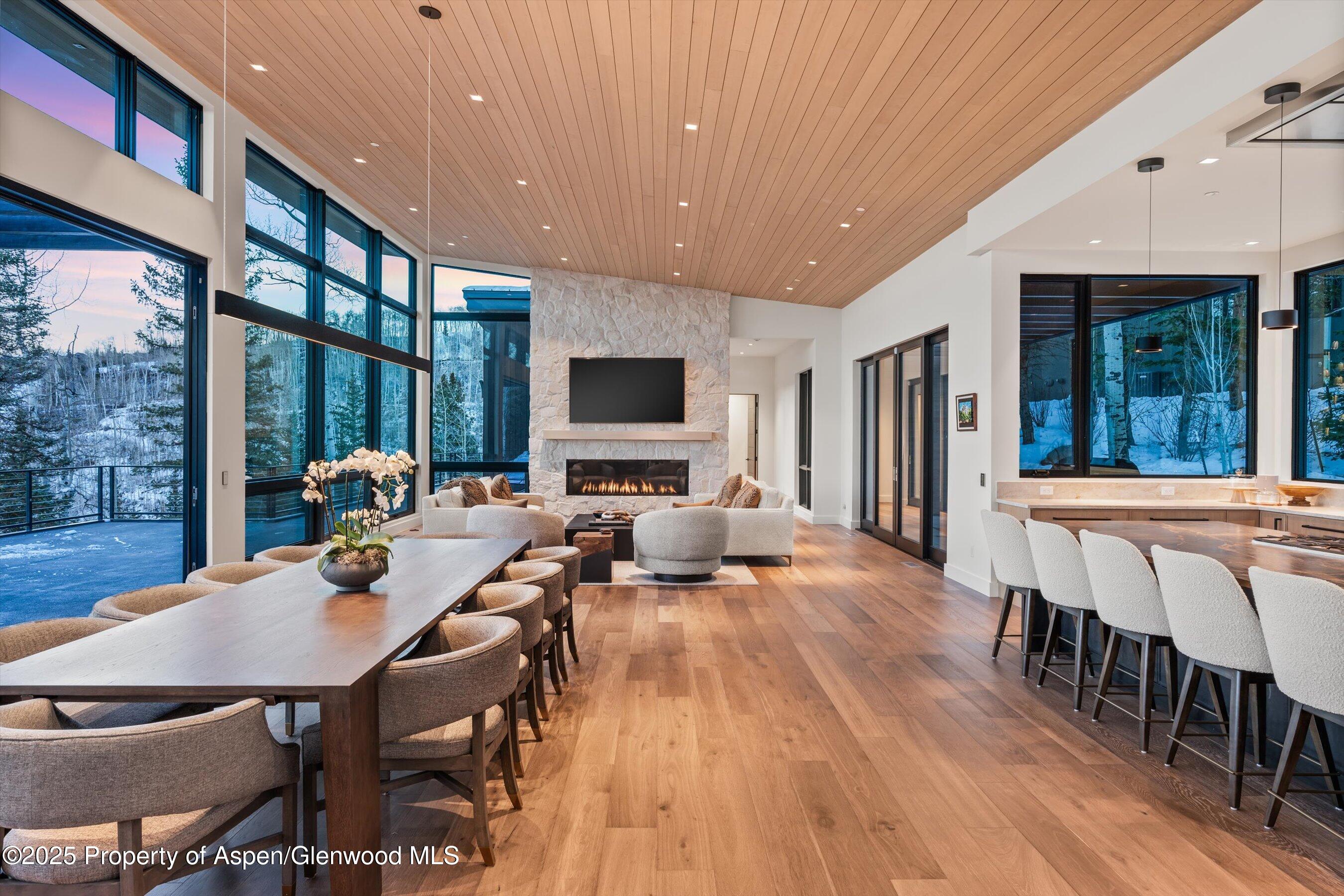 1234 Wood Road Snowmass Village, CO 81615 - Photo 61 of 66 a view of a dining room with furniture window and wooden floor