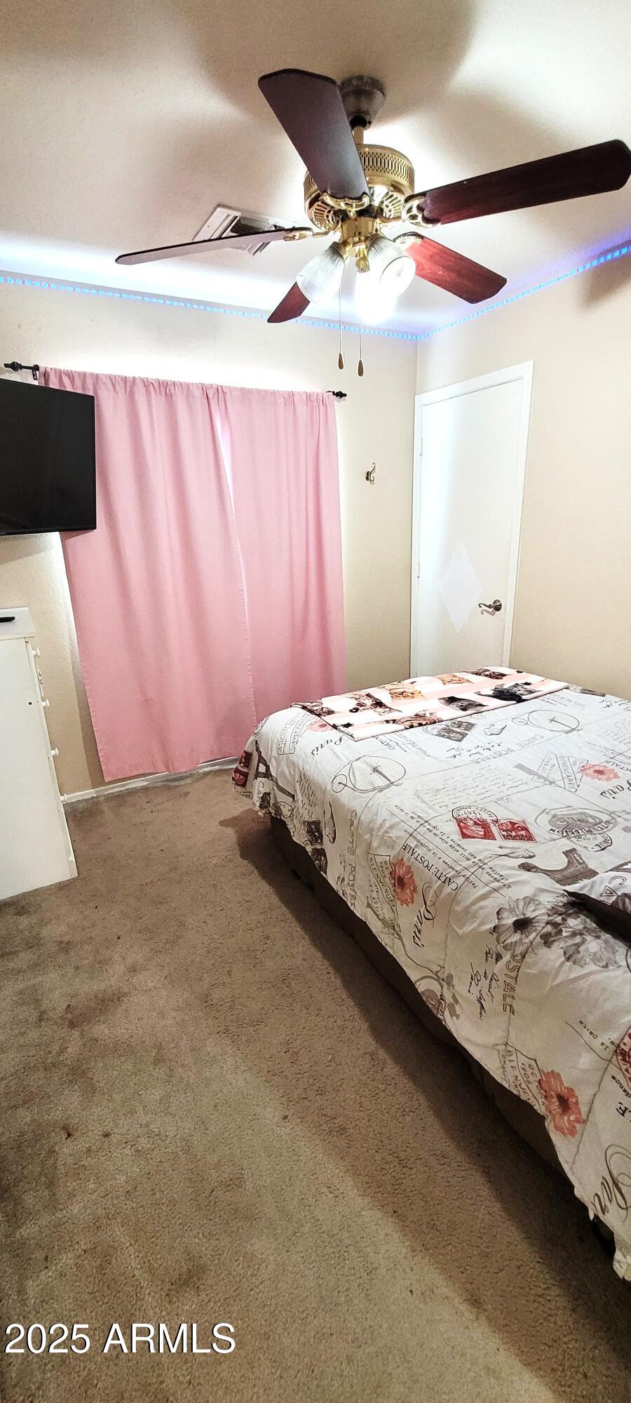 38402 North Basin Road, Unit B Cave Creek, AZ 85331 - Photo 14 of 19 a bedroom with a bed and a window