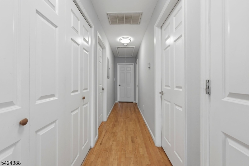 433 Linden Avenue Elizabeth, NJ 07202 - Photo 15 of 33 a view of a hallway with wooden floor and glass door