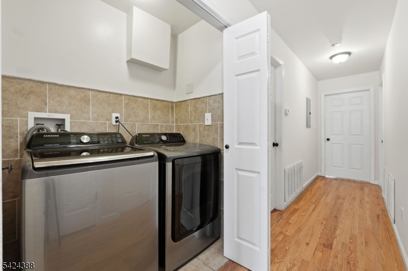 433 Linden Avenue Elizabeth, NJ 07202 - Photo 16 of 33 a kitchen with stainless steel appliances a sink and a refrigerator