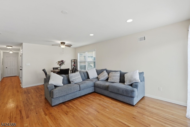 433 Linden Avenue Elizabeth, NJ 07202 - Photo 23 of 33 a living room with furniture and a wooden floor