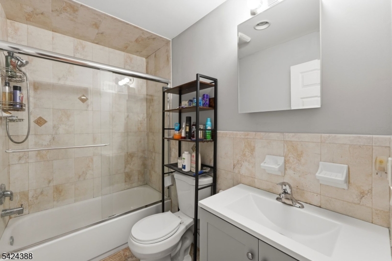 433 Linden Avenue Elizabeth, NJ 07202 - Photo 24 of 33 a bathroom with a sink toilet and shower