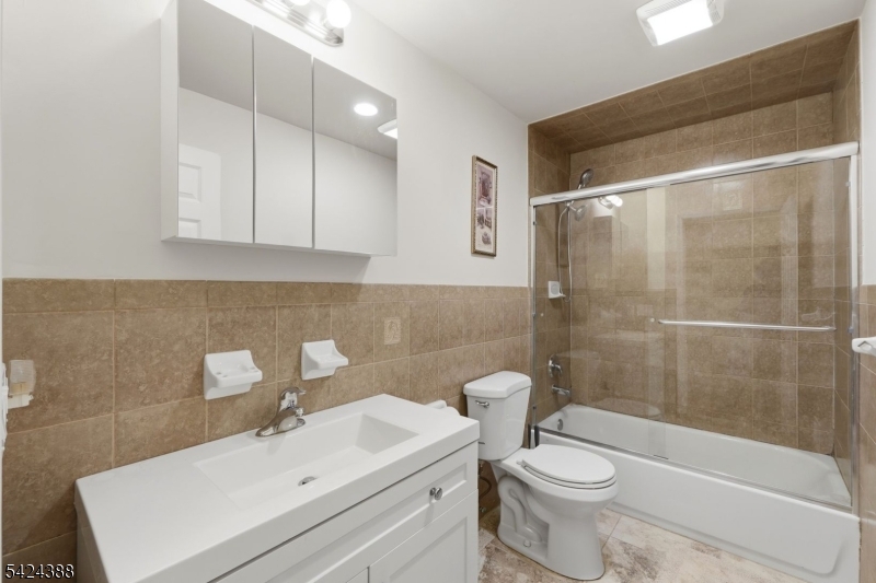 433 Linden Avenue Elizabeth, NJ 07202 - Photo 30 of 33 a bathroom with a sink toilet and shower