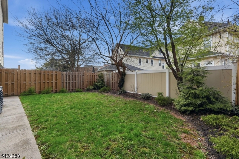 433 Linden Avenue Elizabeth, NJ 07202 - Photo 31 of 33 a view of a house with a yard and a large tree