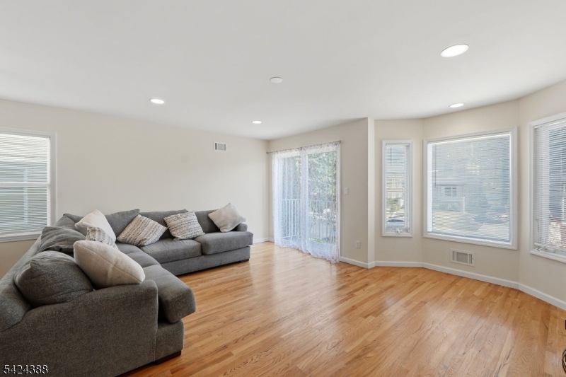 433 Linden Avenue Elizabeth, NJ 07202 - Photo 4 of 33 a living room with furniture and a large window