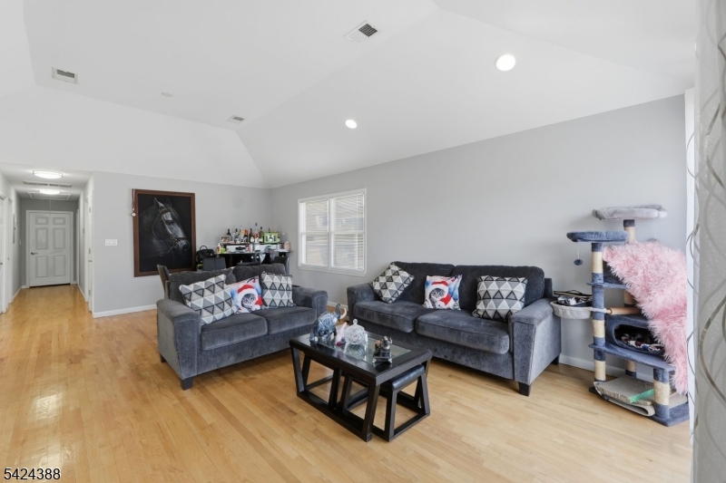 433 Linden Avenue Elizabeth, NJ 07202 - Photo 5 of 33 a living room with furniture and a flat screen tv