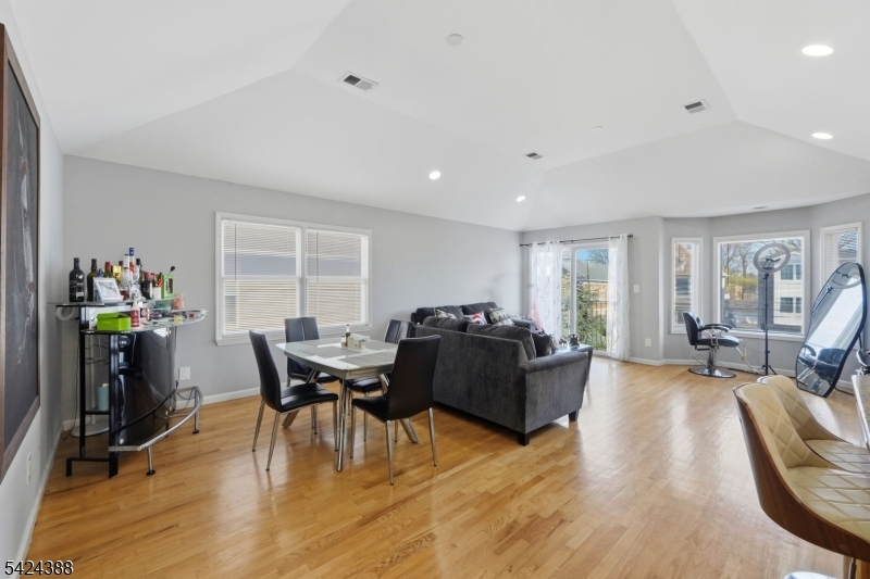 433 Linden Avenue Elizabeth, NJ 07202 - Photo 6 of 33 a living room with furniture and a wooden floor